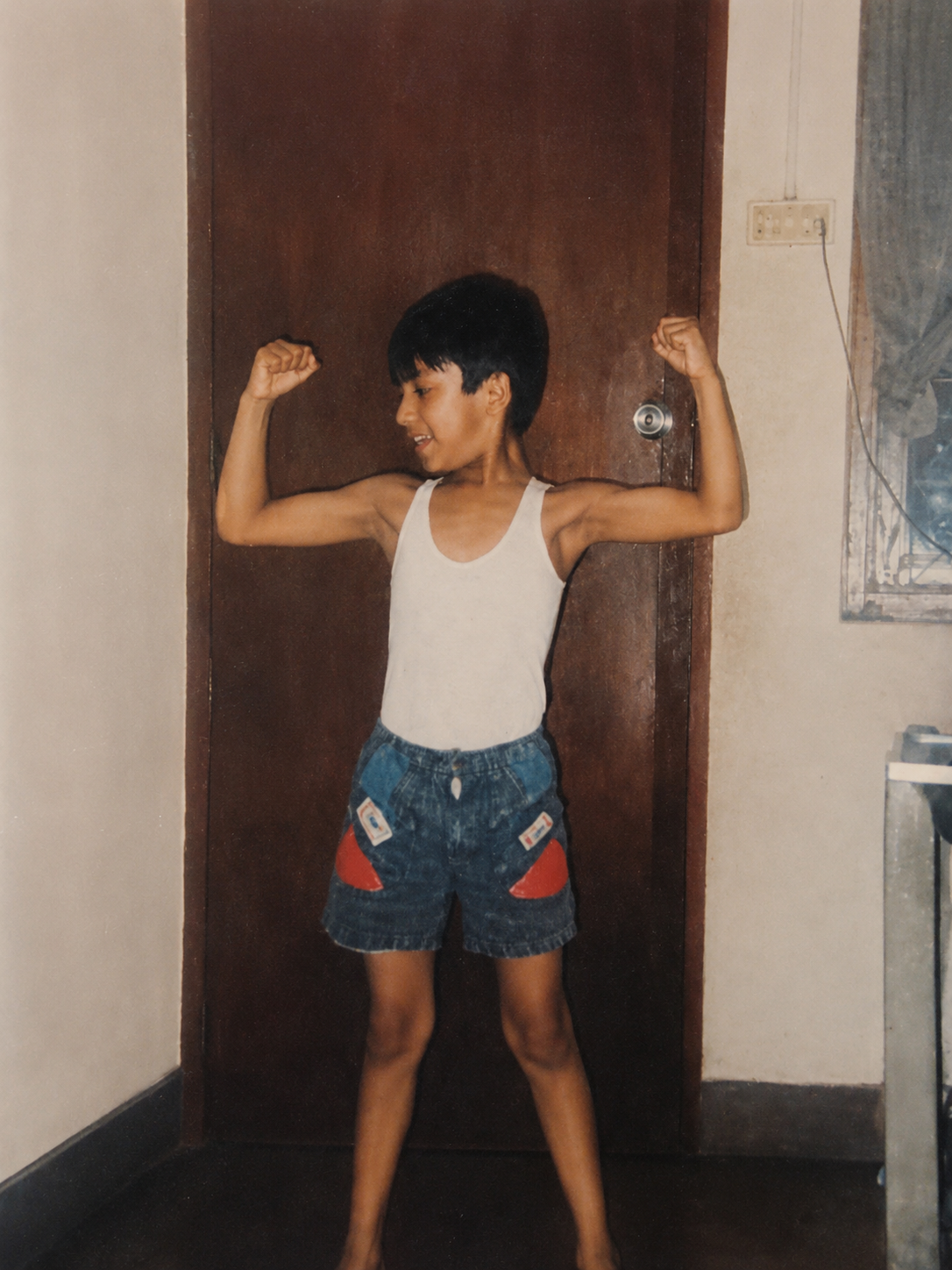 Young Avi flexing as a child